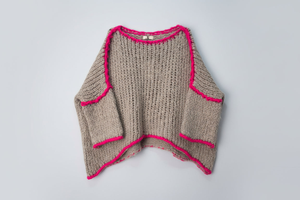Beige and pink knit poncho style jumper